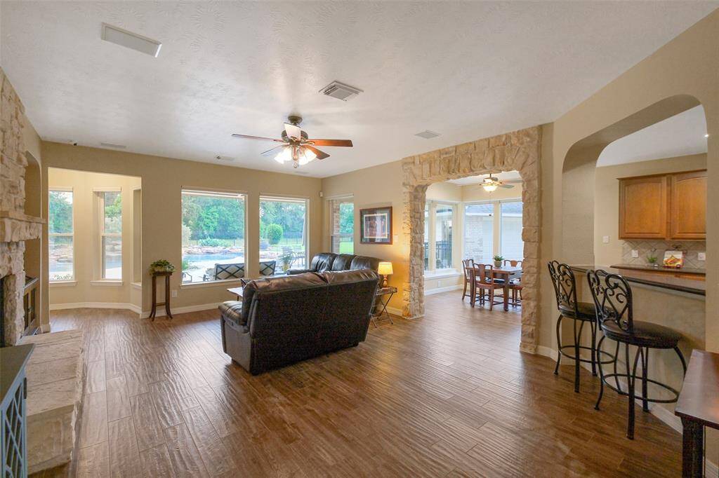 Experience seamless living with an open flow between the family room, breakfast area, and kitchen, complemented by a breakfast bar. Enjoy electric blinds and stunning views of your backyard paradise.
