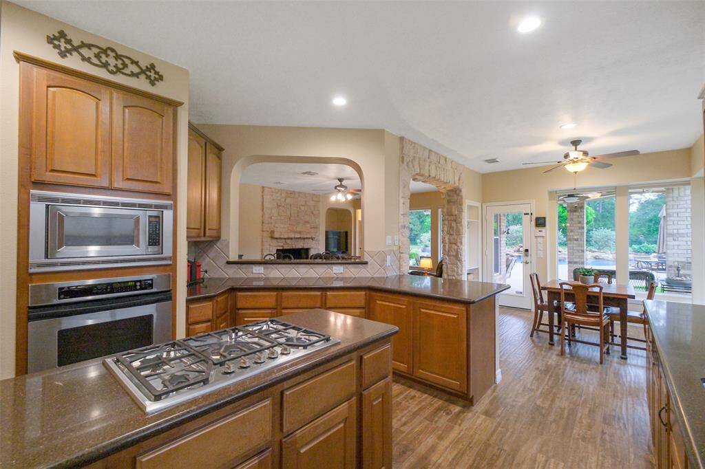 Gourmet kitchen with a 5-burner gas cooktop and a breakfast bar that seamlessly connects to the family room.