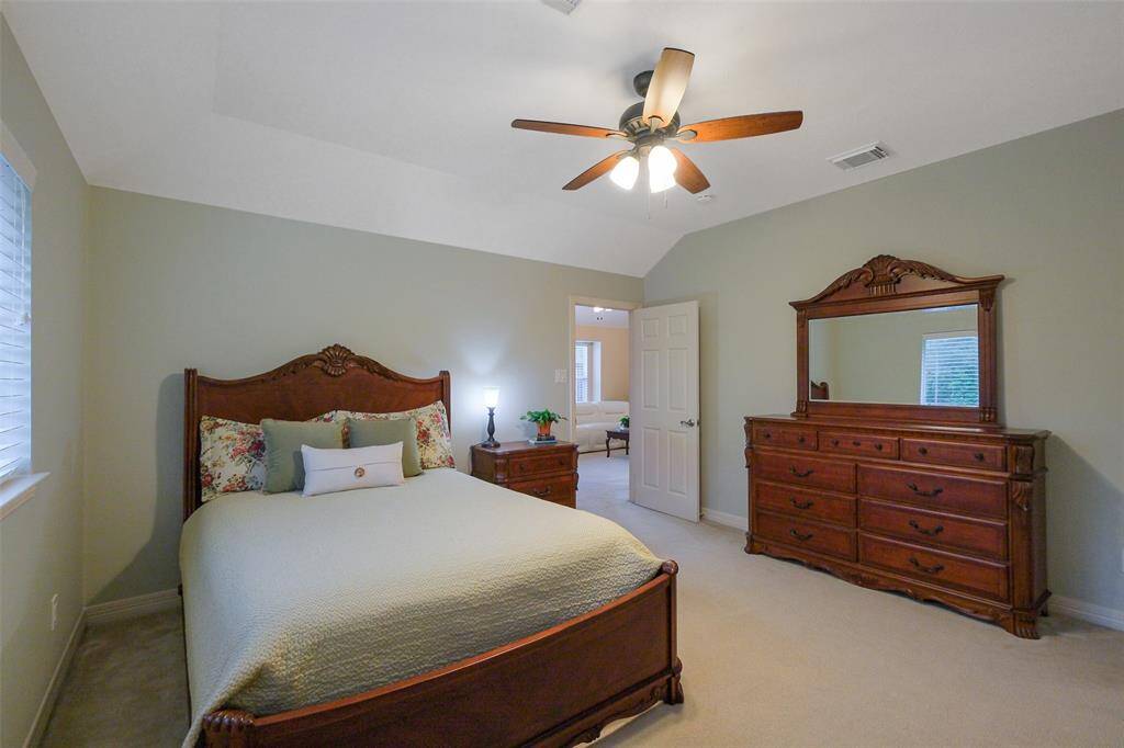 Bedroom 5, featuring a spacious closet and ceiling fan.  All secondary bedrooms are spacious and can accommodate larger furniture.