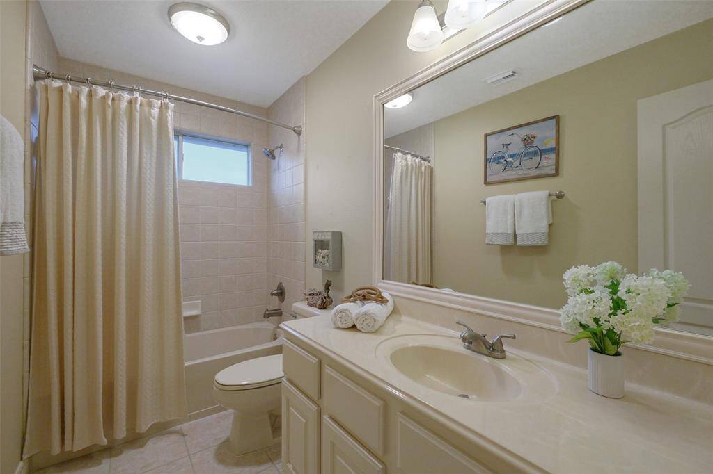 3rd Full bath on the 2nd floor with ample storage and updated lighting.