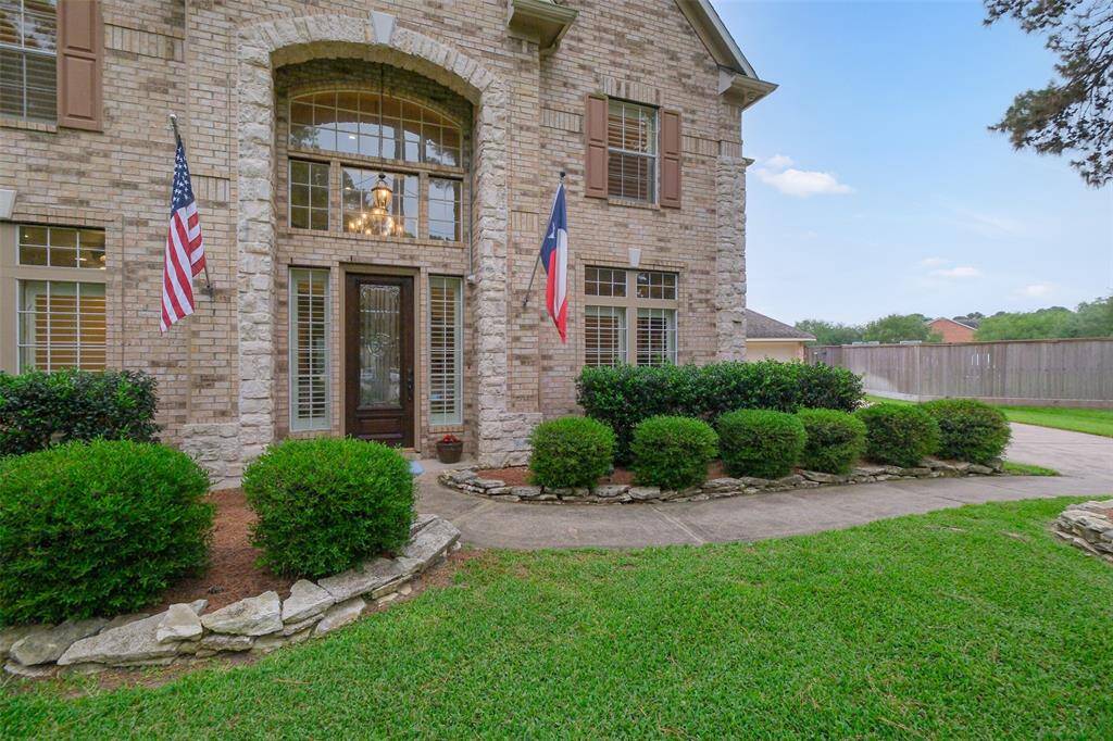 Welcoming entrance and a gorgeous brick and stone exterior.