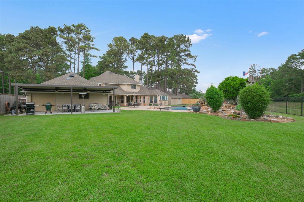 Expansive green space perfect for pets and play, offering serene beauty and endless outdoor enjoyment.