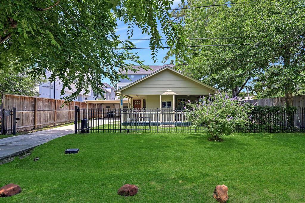 Charming updated 4-bedroom, 2.5-bath bungalow nestled on a fully fenced 5,226 SF lot in desirable Heights.