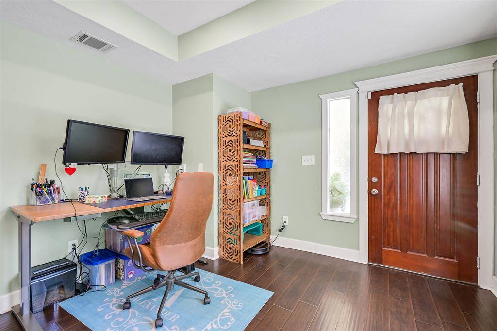 Front of home features den area great for home office or flex space.