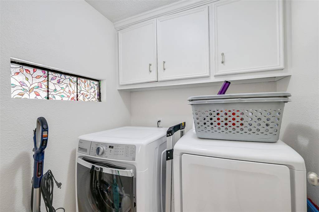 In house laundry with storage.