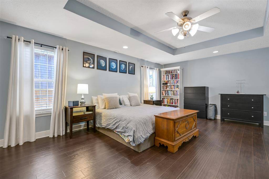 Light-filled primary suite, complete w/a walk-in closet, & space for a cozy sitting area.