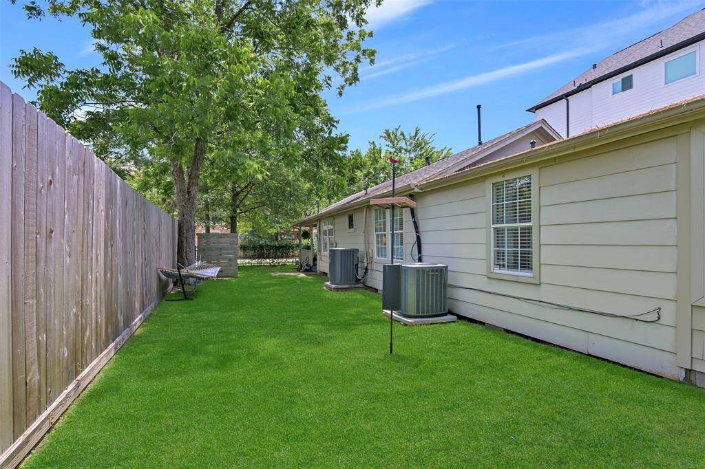 Home features gutters, recent roof ridge cap 2024, surface drains under pier beam and TRANE HVAC 2018 & 2024.