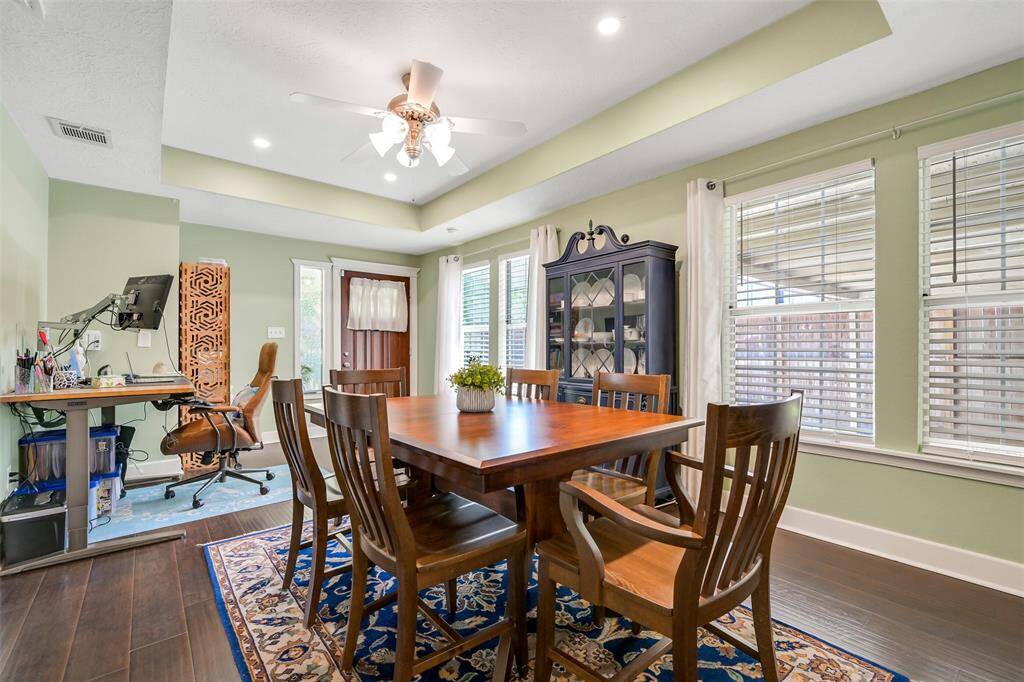 Room features recent LED recessed lighting, ceiling fan and 2 inch blinds.