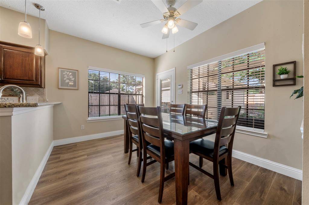 The breakfast area can accommodate a large table, and the bar can seat more if needed.
