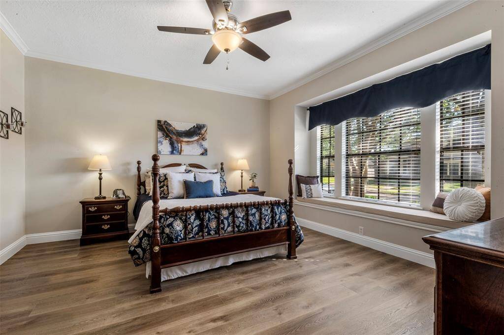 The primary bedroom is spacious and has the perfect bench seating for reading.