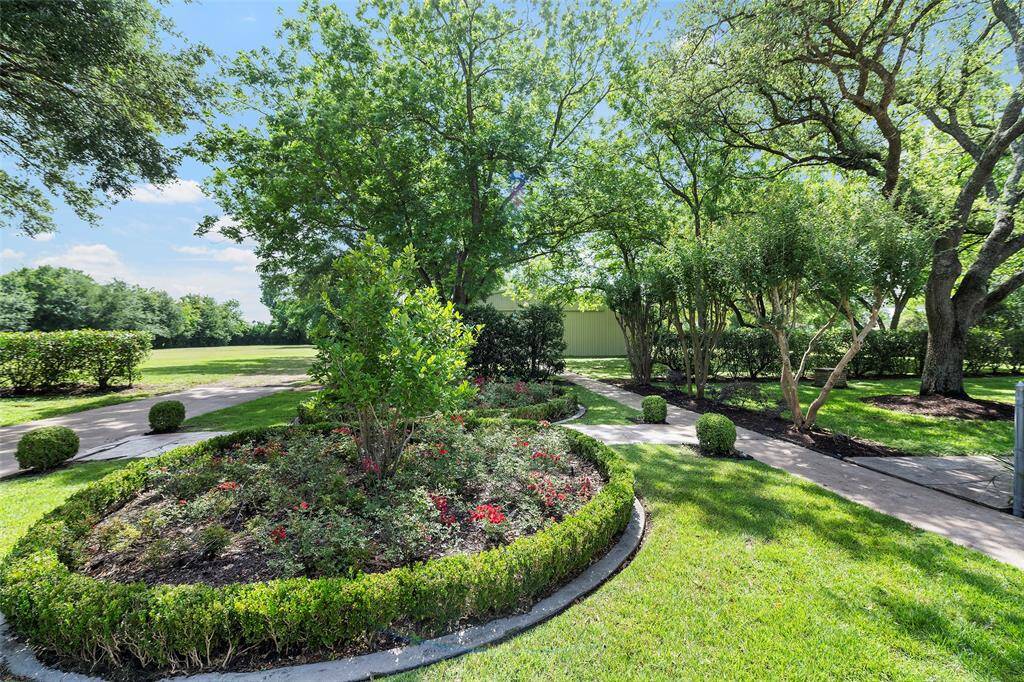 Perfectly lined pathways lead you throughout the property and to unexpected places!  So many endless possibilities!