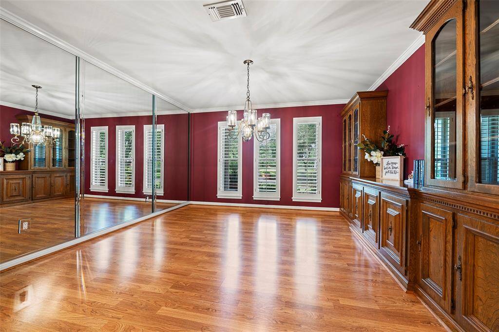 WOW!  This formal dining space has a wall of windows where the natural light just lets the room shine, and the chandelier adds additional light as well!  Imagine family meals or having late-night card games with friends in this space!
