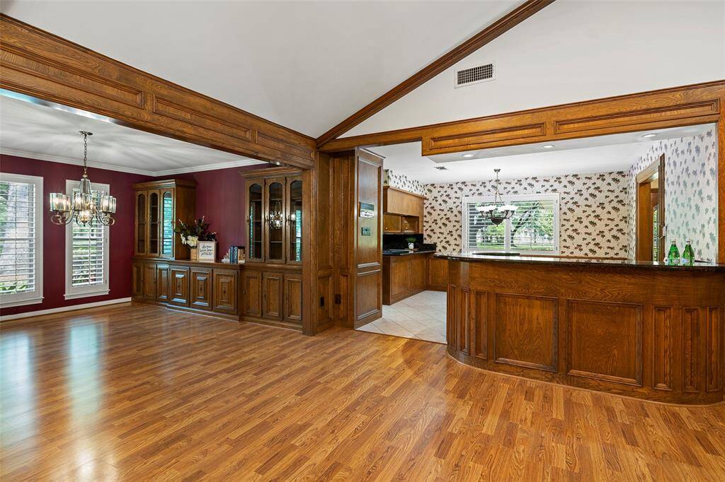 The open floor plan is PERFECT for entertaining!  From the dining room, family room and raised bar space, you have yourself the best place for parties!