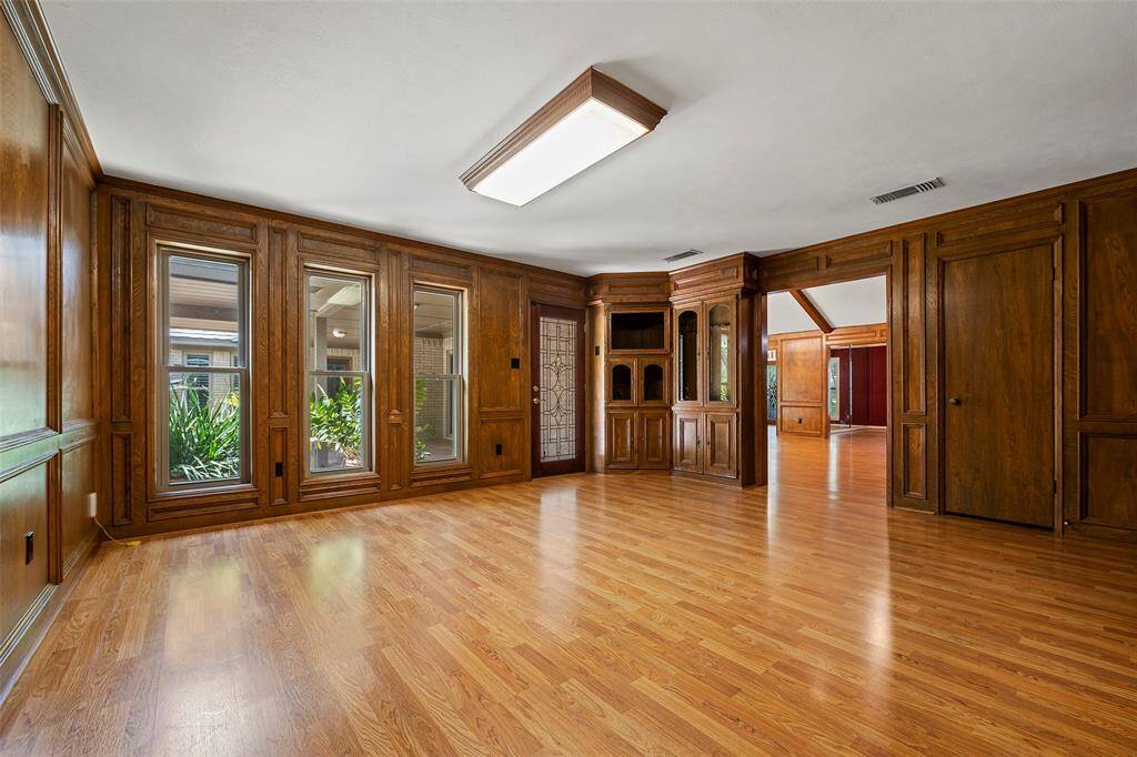 Just off the family room, you will find the AWESOME flex room with such character and charm! This space could be set up with a pool table, some cigar chairs for evening entertaining or maybe an antique desk with wingback chairs and bookcase for the perfect home office!