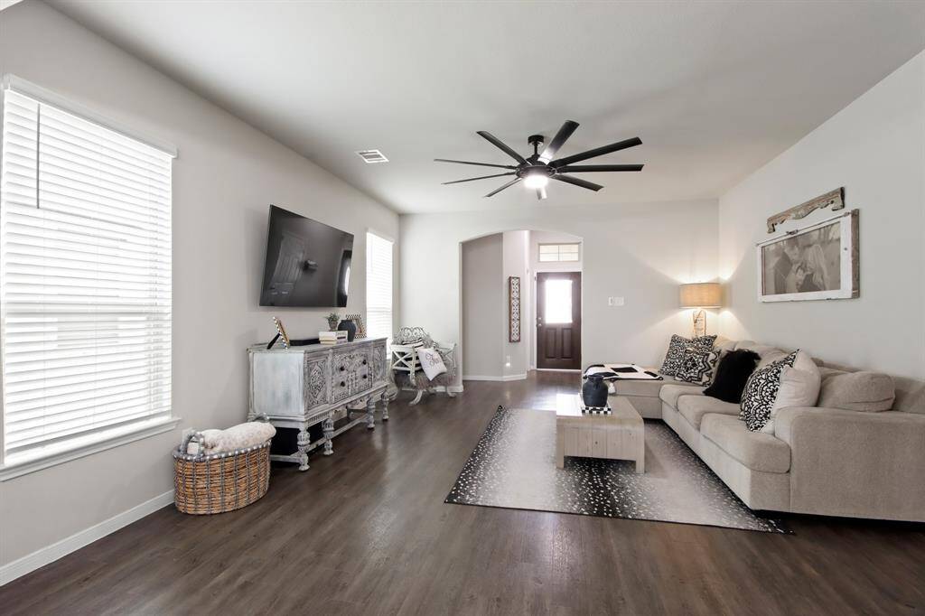 Another view of the beautiful living room. Notice the space is bright and inviting, ideal for relaxation and entertainment.