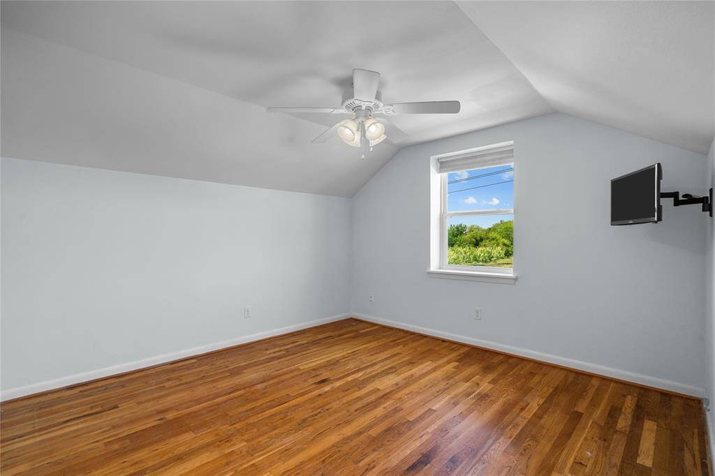 Bedroom 2 with mounted tv.