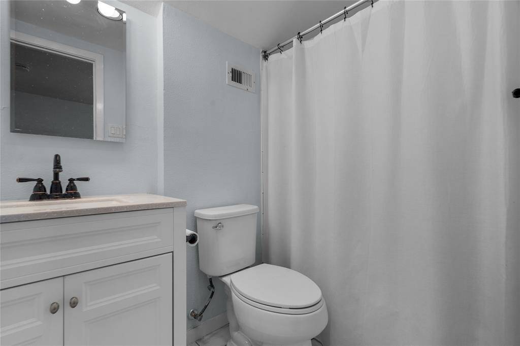 Upstairs bathroom, connected to the common area.