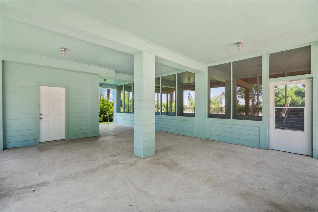 Underneath the house, washer room and screened porch.