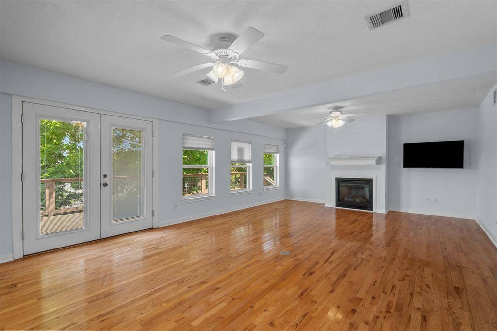 Living/Dining with fireplace and a good outside view.