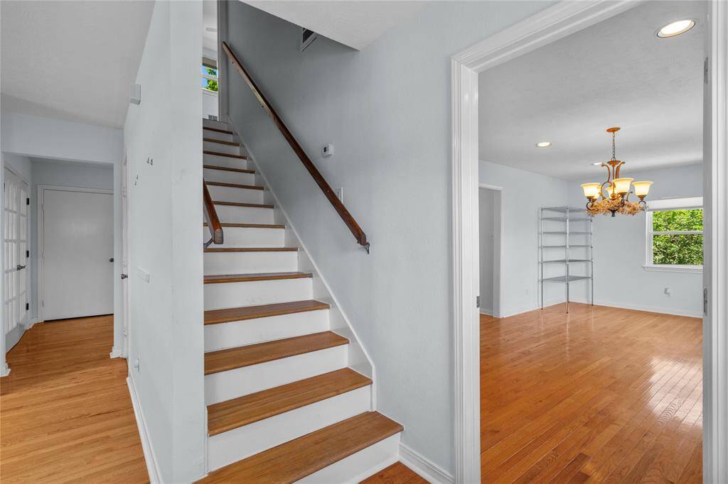stairs leading upstairs and a storage room underneath.