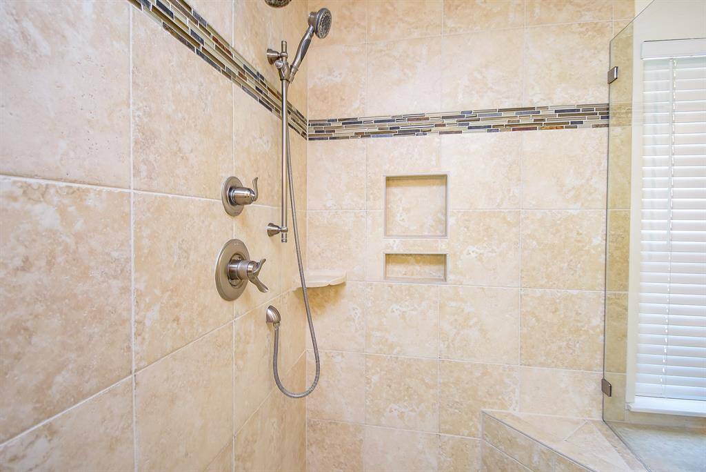 Walk-in tile shower perfect for all ages.