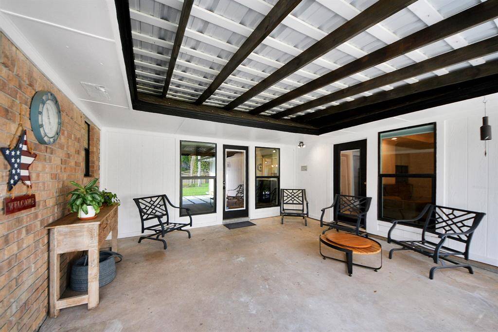 Another view of the covered patio showcases the generous shaded space—an ideal spot to stay cool and out of the sun during those hot Texas summers.