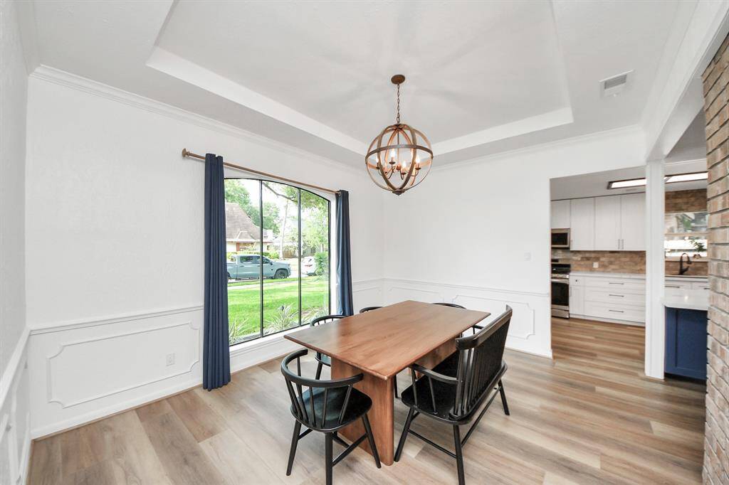 The dining room flows into the gourmet kitchen, creating the perfect layout for effortless entertaining and everyday gatherings.