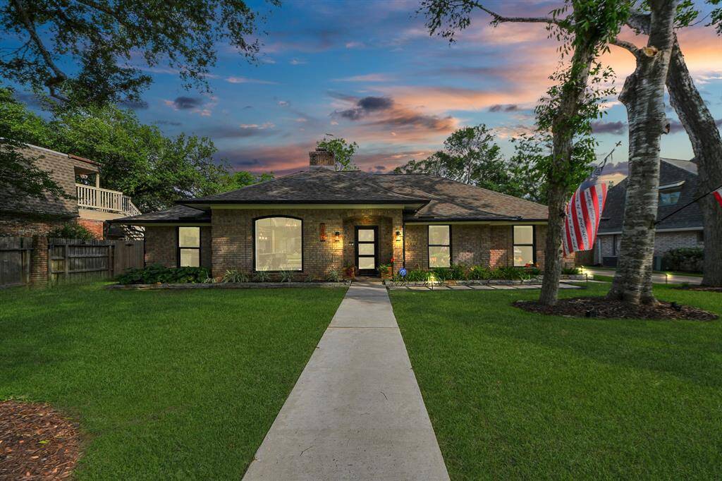 The beauty of this home truly shines at night, with tasteful lighting highlighting its elegant features and welcoming curb appeal.