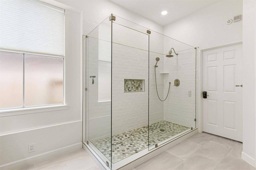 California Closet system allows lots of space for shoes!  This closet will keep you organized. A mirror above the shelves bring in natural light.