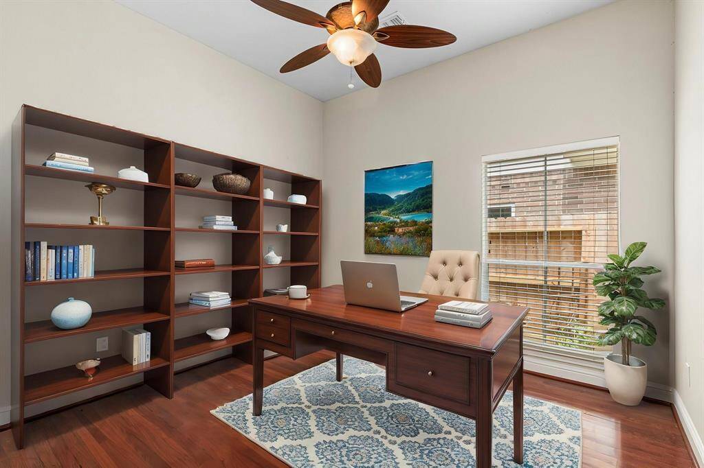 The second bedroom has been staged to look like an office.