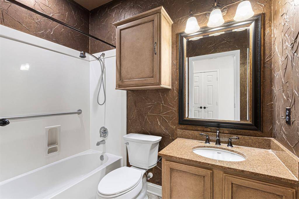 There's a full bathroom adjacent to the second bedroom down.