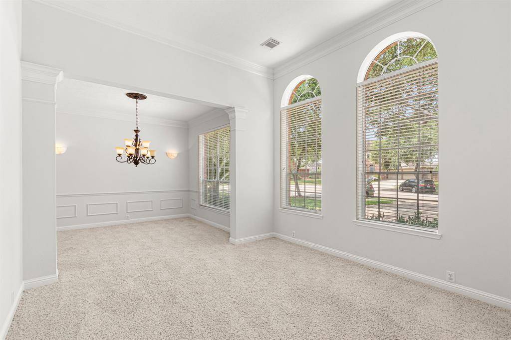 The formal living and dining rooms are light and bright!
