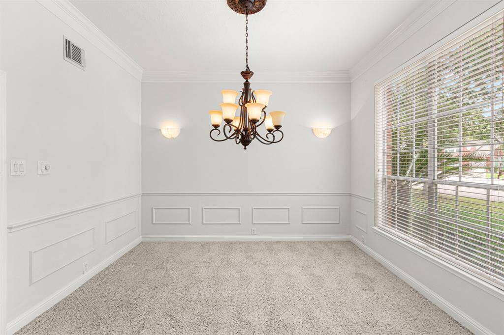 Formal dining room has wall mounted sconces which can be dimmed for mood. Chandelier has a dimmer as well.