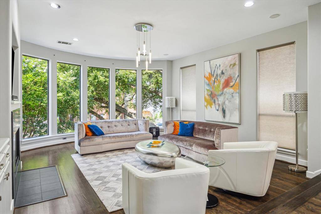 Living space with windows which allow for natural light and views of the mature oak tree.