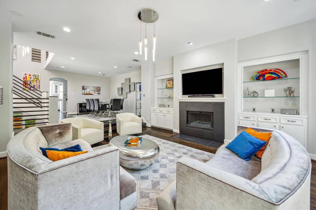Another view of the living area which is sunken and is adjacent to the dining area.