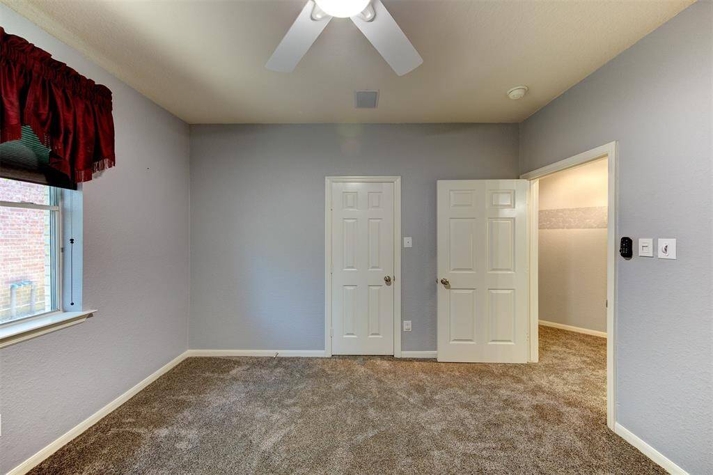 3rd bedroom with walk in closet and in-ceiling speakers