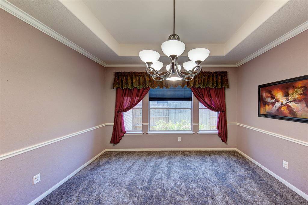 Formal dining room w/recessed ceiling and chair rail