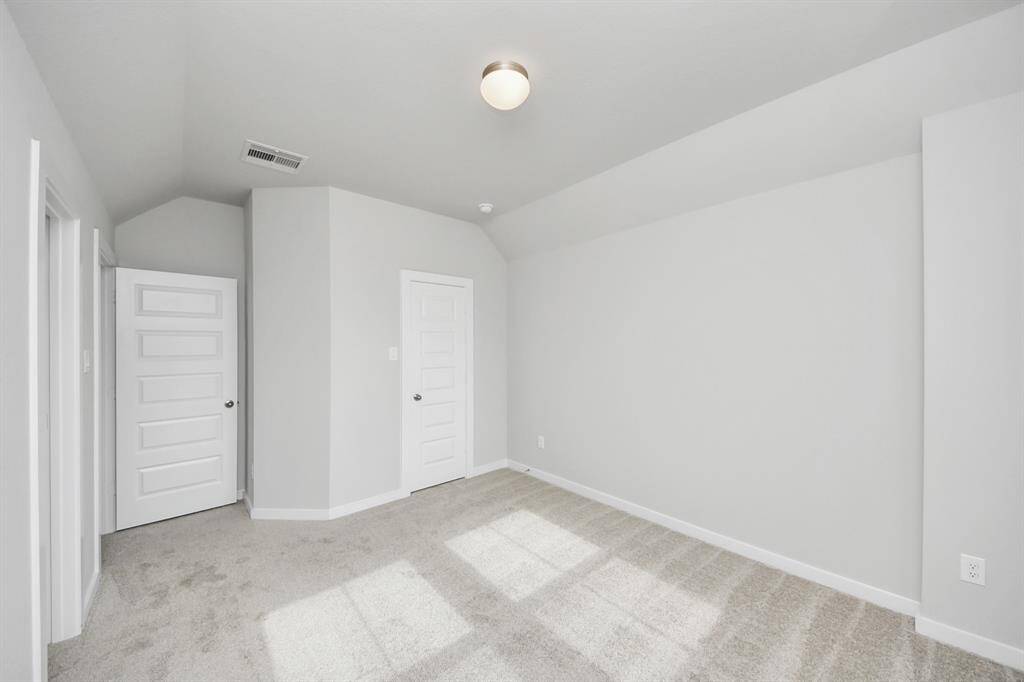 Generously sized secondary bedrooms featuring spacious closets, soft and inviting carpetingunderfoot, large windows allowing plenty of natural light, and the added touch of privacyblinds for your personal retreat.