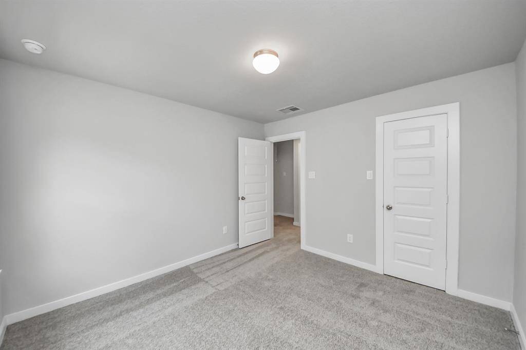Generously sized secondary bedrooms featuring spacious closets, soft and inviting carpetingunderfoot, large windows allowing plenty of natural light, and the added touch of privacyblinds for your personal retreat.
