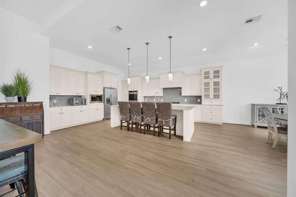 This exquisite kitchen has tons of cabinet space and deep drawers for storage.