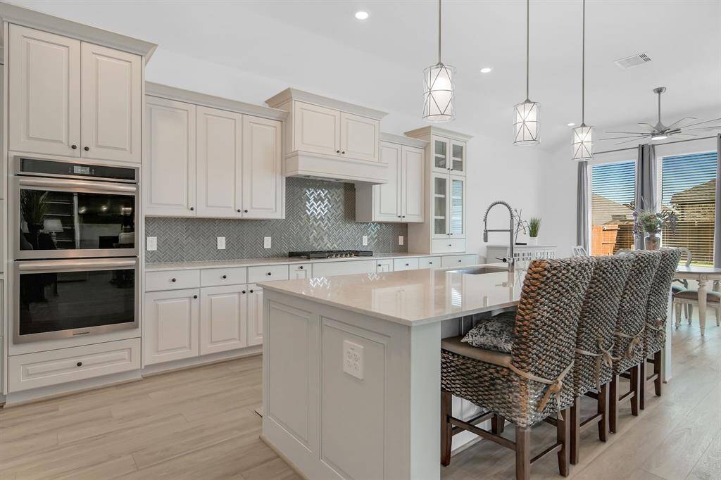 Tons of counter space and a large island allow for plenty of space for prepping meals.