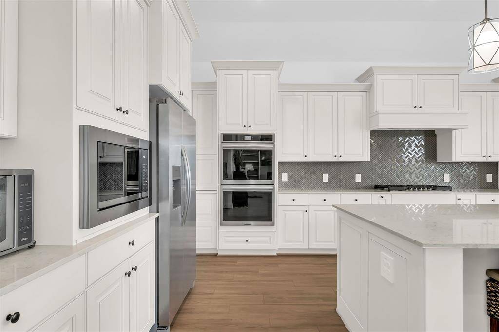 Modern kitchen featuring sleek stainless steel appliances and elegant quartz countertops—perfect for everyday cooking and entertaining.