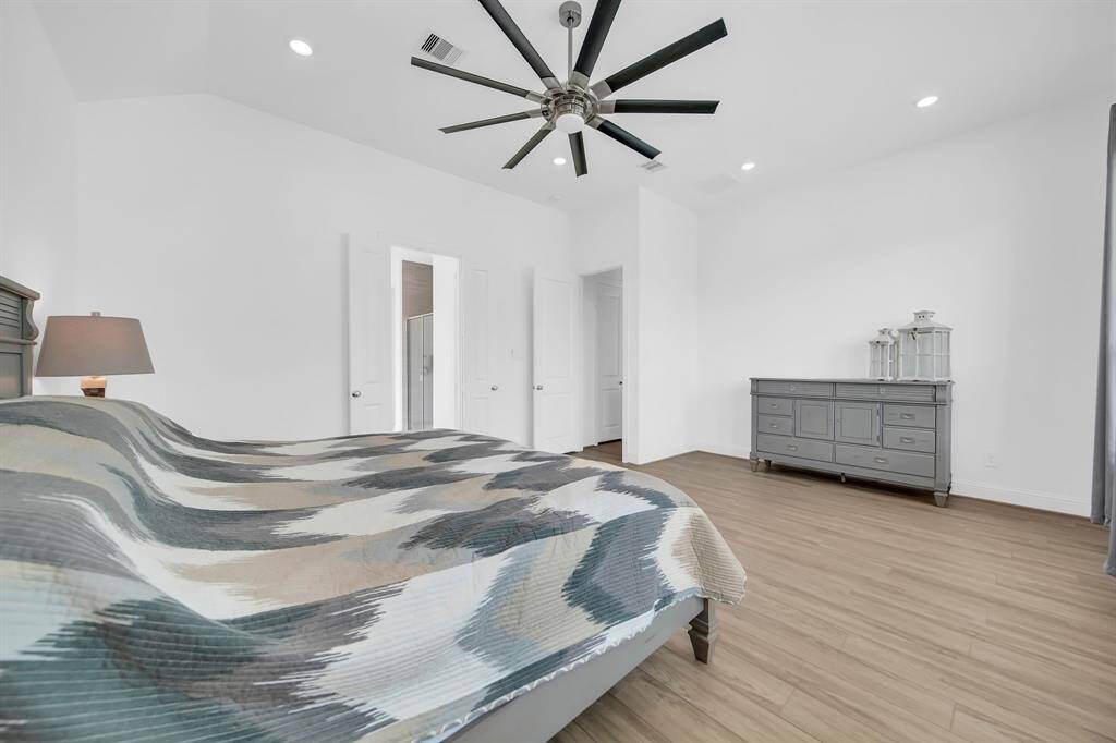 The large primary bedroom has a private bath and large walk-in closet.