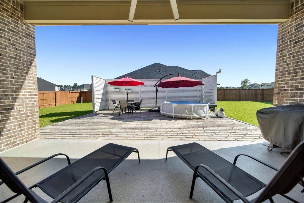 The covered patio has a huge 82" ceiling fan to help keep you cool this summer!