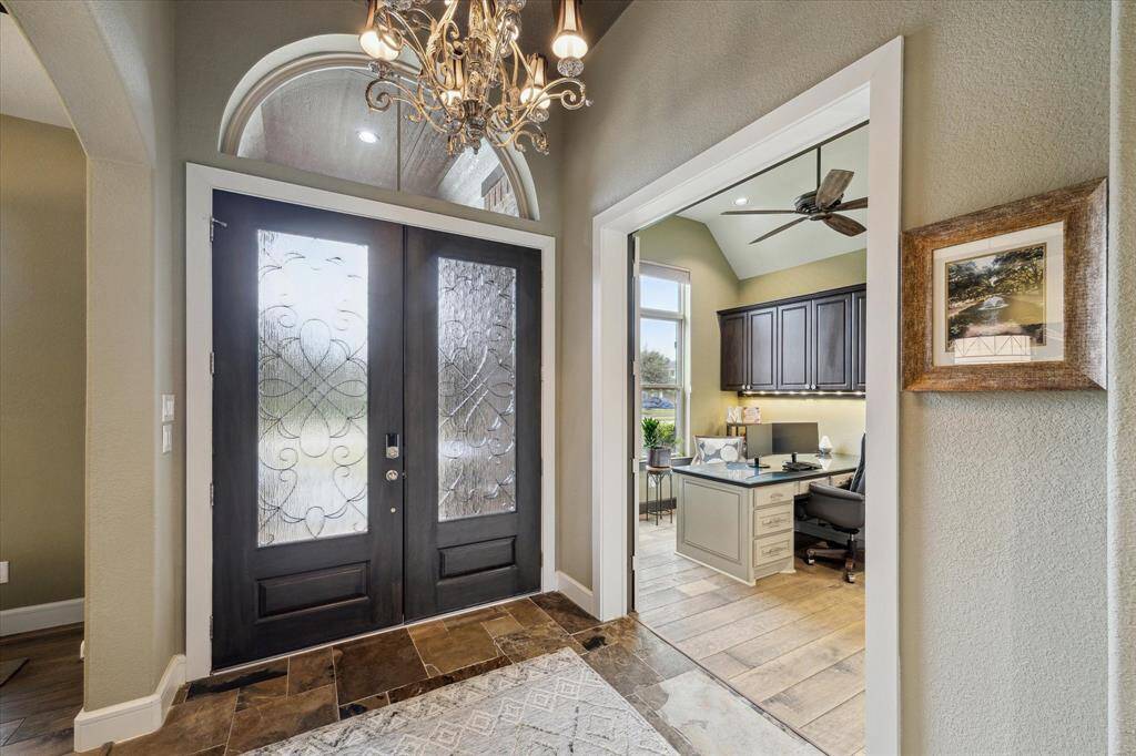 Heavy duty double front doors leading to the formal study.