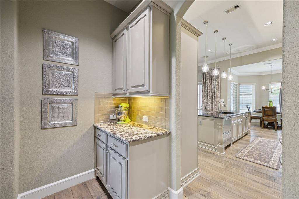 Subtle but lovely butler's pantry with undercounter lights.