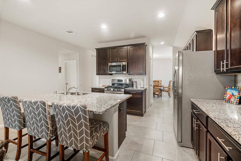 Step into the formal dining room, conveniently adjacent to a spacious pantry.