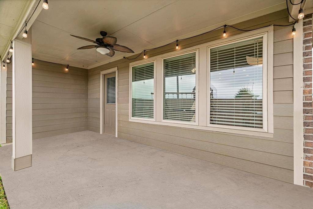 Step outside to a charming covered patio that’s perfect for relaxing or entertaining! This spacious area features a stylish ceiling fan for added comfort, and durable concrete flooring that’s low-maintenance and ready for outdoor furniture. Whether you’re hosting weekend barbecues or enjoying a quiet morning coffee, this inviting space extends your living area into the outdoors with ease.