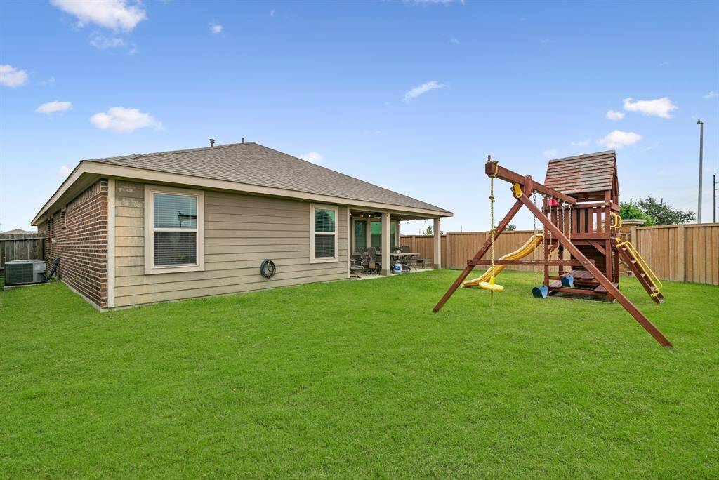 Transform your gardening dreams into reality in this inviting backyard oasis.