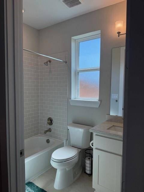 Well appointed modern guest bath with privacy glass.